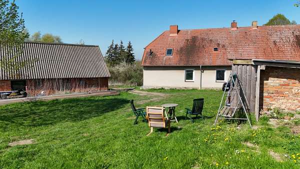 Gebäuderückansicht - Doppelhaushälfte in 18233 Carinerland mit 125m² kaufen