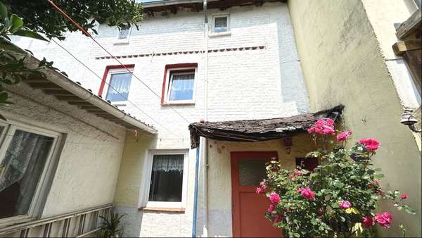 rückwärtige Gebäudeansicht - Einfamilienhaus in 18258 Schwaan mit 71m² kaufen