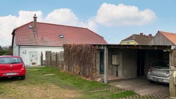 Außenansicht mit Carport Außenansicht mit Carport - Einfamilienhaus in 17391 Krusenfelde mit 170m² kaufen