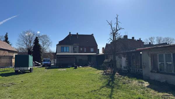 Gartenansicht Gartenansicht - Mehrfamilienhaus in 03130 Tschernitz mit 275m² als Kapitalanlage kaufen