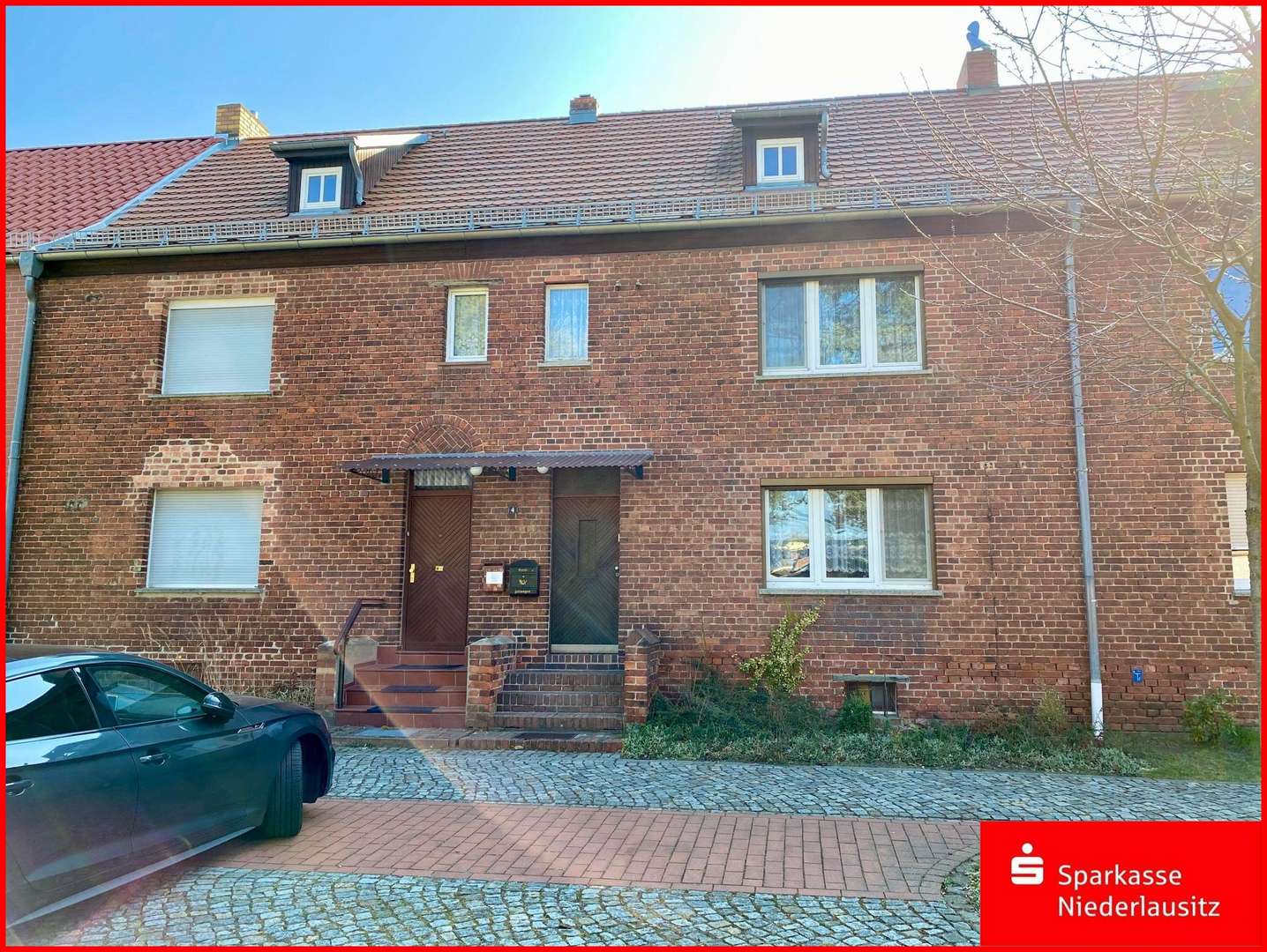 Wohnhaus von der Straße aus gesehen - Reihenmittelhaus in 03119 Welzow mit 110m² kaufen