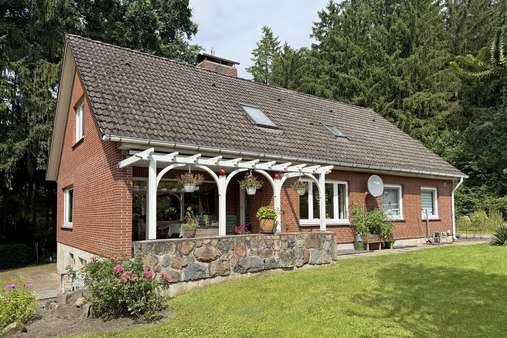 Seitenansicht 1 - Einfamilienhaus in 21256 Handeloh mit 190m² kaufen