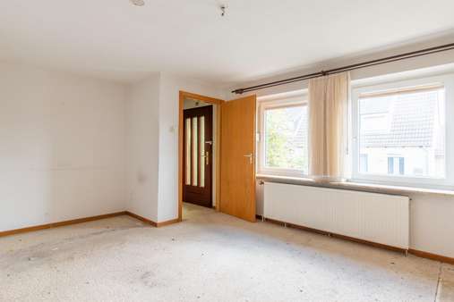 Wohnzimmer - Doppelhaushälfte in 24232 Schönkirchen mit 60m² kaufen