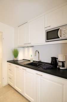 Küche mit Einbauküche - Etagenwohnung in 25980 Sylt mit 54m² günstig kaufen