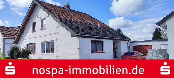 Ebenerdig bewohnbare und vielfach modernisierte Doppelhaushälfte mit Balkon und Garage! 