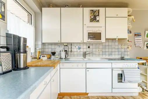 3-Zimmer-Dachgeschosswohnung mit Garage, Loggia und Gartenanteil in ruhiger Lage!
