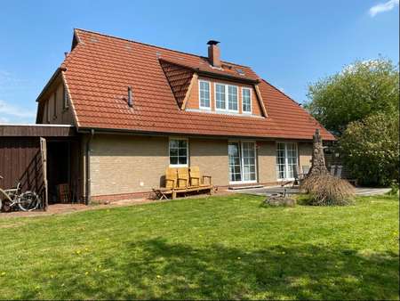 Rückseite im Sommer - Zweifamilienhaus in 25573 Beidenfleth mit 202m² kaufen