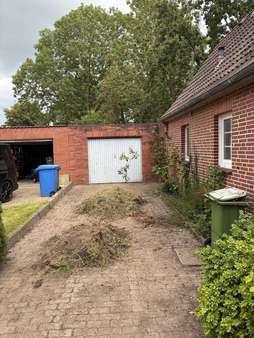 Außen Auffahrt Garage - Einfamilienhaus in 25704 Meldorf mit 79m² kaufen