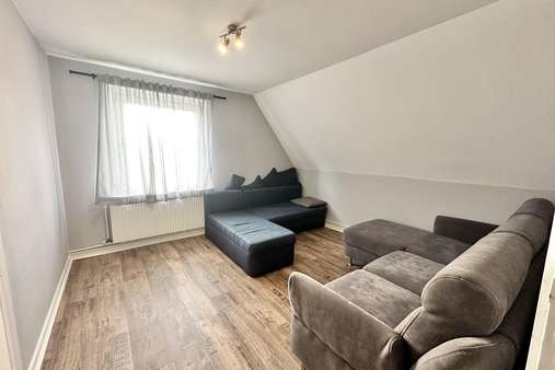 Wohnzimmer Wohnzimmer - Dachgeschosswohnung in 23669 Timmendorfer Strand mit 35m² kaufen