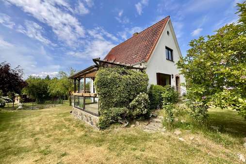 Gartenansicht - Einfamilienhaus in 23560 Lübeck mit 104m² kaufen