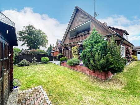 Gartenansicht - Zweifamilienhaus in 21717 Fredenbeck mit 160m² kaufen
