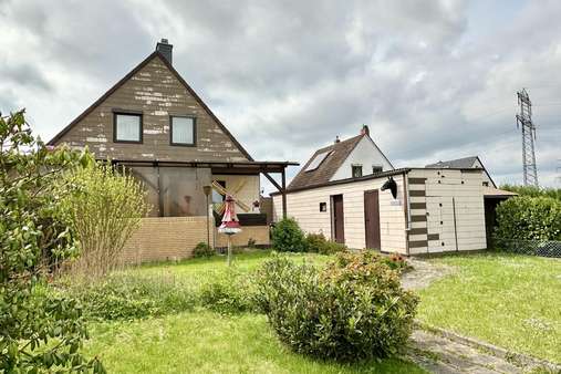Gartenansicht - Einfamilienhaus in 38159 Vechelde mit 100m² kaufen