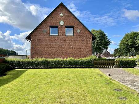 Garten - seitliche Hausansicht - Einfamilienhaus in 29664 Walsrode mit 200m² kaufen