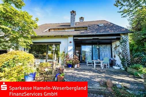 Rückwärtige Ansicht / Terrasse - Einfamilienhaus in 37619 Bodenwerder mit 172m² kaufen