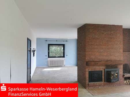 Wohnbereich mit Kaminofen - Einfamilienhaus in 37619 Bodenwerder mit 172m² kaufen