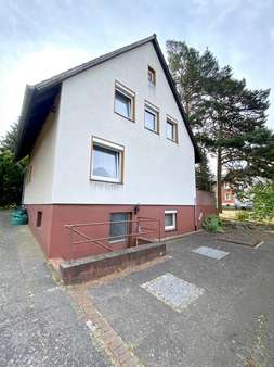 Westansicht mit Kellereingang - Einfamilienhaus in 29549 Bad Bevensen mit 95m² kaufen