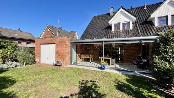 Gartenansicht - Doppelhaushälfte in 49134 Wallenhorst mit 101m² günstig kaufen