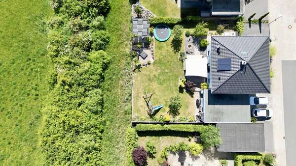 Luftbild vom Grundstück - Einfamilienhaus in 49201 Dissen mit 142m² kaufen