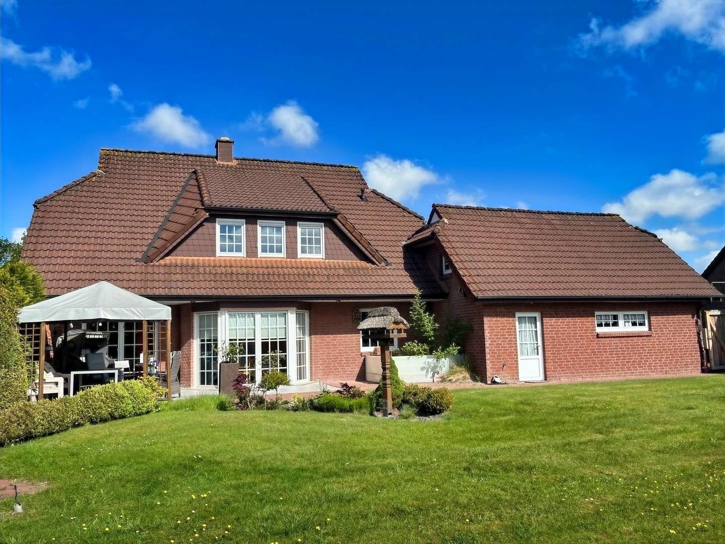 Gartenansicht Gartenansicht - Einfamilienhaus in 26632 Ihlow mit 165m² kaufen