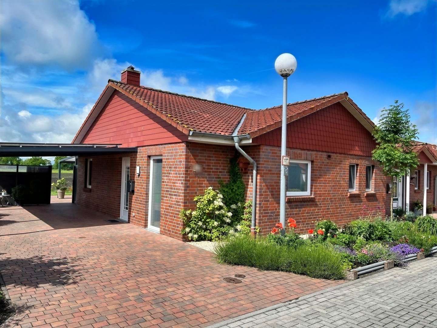 Straßenansicht - Reihenendhaus in 26624 Südbrookmerland mit 74m² kaufen
