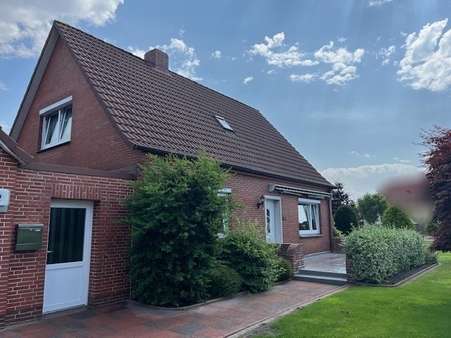 Hausansicht und Zwischenbau Hausansicht und Zwischenbau - Einfamilienhaus in 26506 Norden mit 100m² kaufen