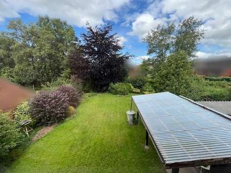 Blick in den Garten - Einfamilienhaus in 26524 Hage mit 140m² kaufen