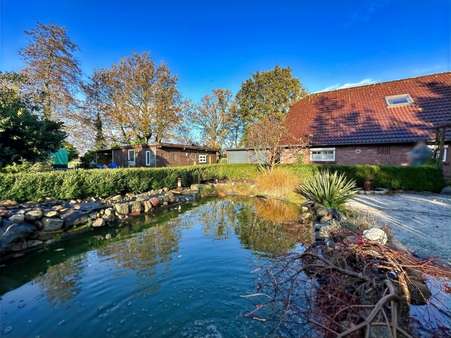Teich mit Ansicht - Bauernhaus in 26532 Großheide mit 176m² kaufen