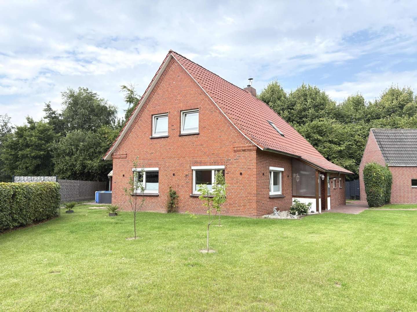 Gartenansicht - Einfamilienhaus in 26624 Südbrookmerland mit 130m² kaufen