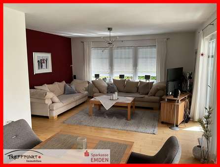 Wohnzimmer mit Zugang zum Sommergarten - Einfamilienhaus in 26725 Emden mit 120m² kaufen