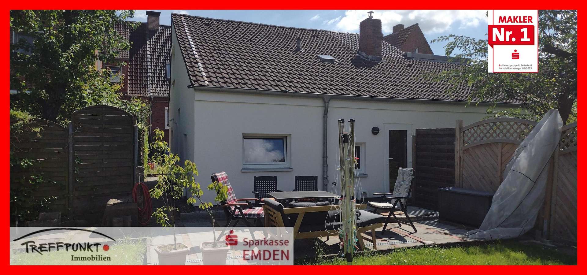 Hausrückseite mit Terrasse und Garten - Einfamilienhaus in 26721 Emden mit 70m² kaufen