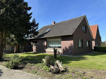 Seitenansicht - Einfamilienhaus in 26842 Ostrhauderfehn mit 129m² kaufen