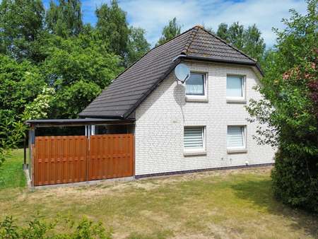 Vorderansicht - Einfamilienhaus in 26802 Moormerland mit 128m² kaufen