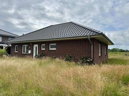 Vorderansicht - Bungalow in 26802 Moormerland mit 113m² kaufen