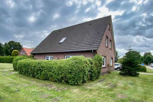 Seitenansicht - Einfamilienhaus in 26532 Großheide mit 150m² kaufen