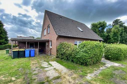 Seitliche Rückansicht - Einfamilienhaus in 26532 Großheide mit 150m² kaufen