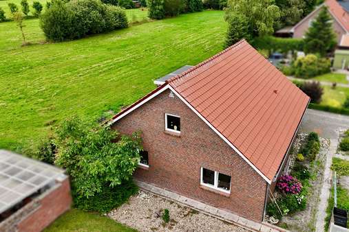 Seitenansicht - Einfamilienhaus in 26826 Weener mit 113m² kaufen