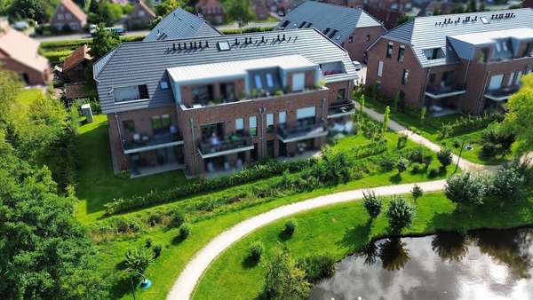 Rückansicht Vogelperspektive - Dachgeschosswohnung in 26817 Rhauderfehn mit 75m² kaufen