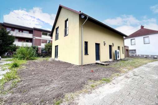 Seitenansicht Seitenansicht - Doppelhaushälfte in 26789 Leer mit 90m² kaufen