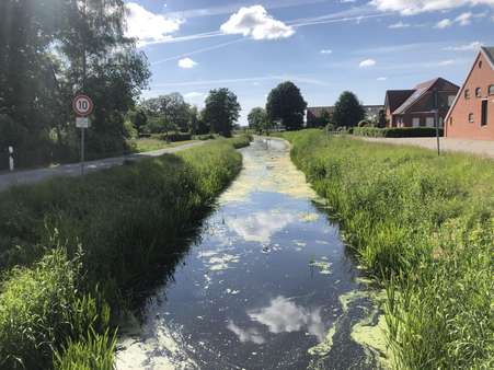 Kanal - Grundstück in 26802 Moormerland mit 1437m² günstig kaufen