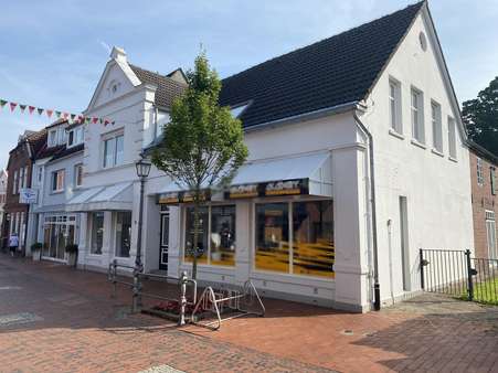 Seitliche Frontansicht - Mehrfamilienhaus in 26409 Wittmund mit 94m² kaufen