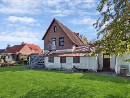 Gartenansicht - Zweifamilienhaus in 27339 Riede mit 167m² günstig kaufen
