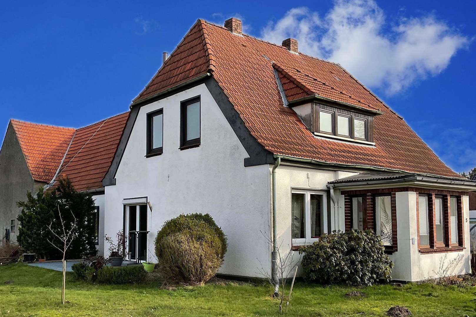 Seitliche Straßenansicht - Einfamilienhaus in 27321 Emtinghausen mit 110m² kaufen