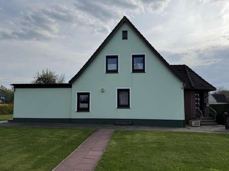 Seitenansicht - Einfamilienhaus in 27639 Wurster Nordseeküste mit 129m² kaufen