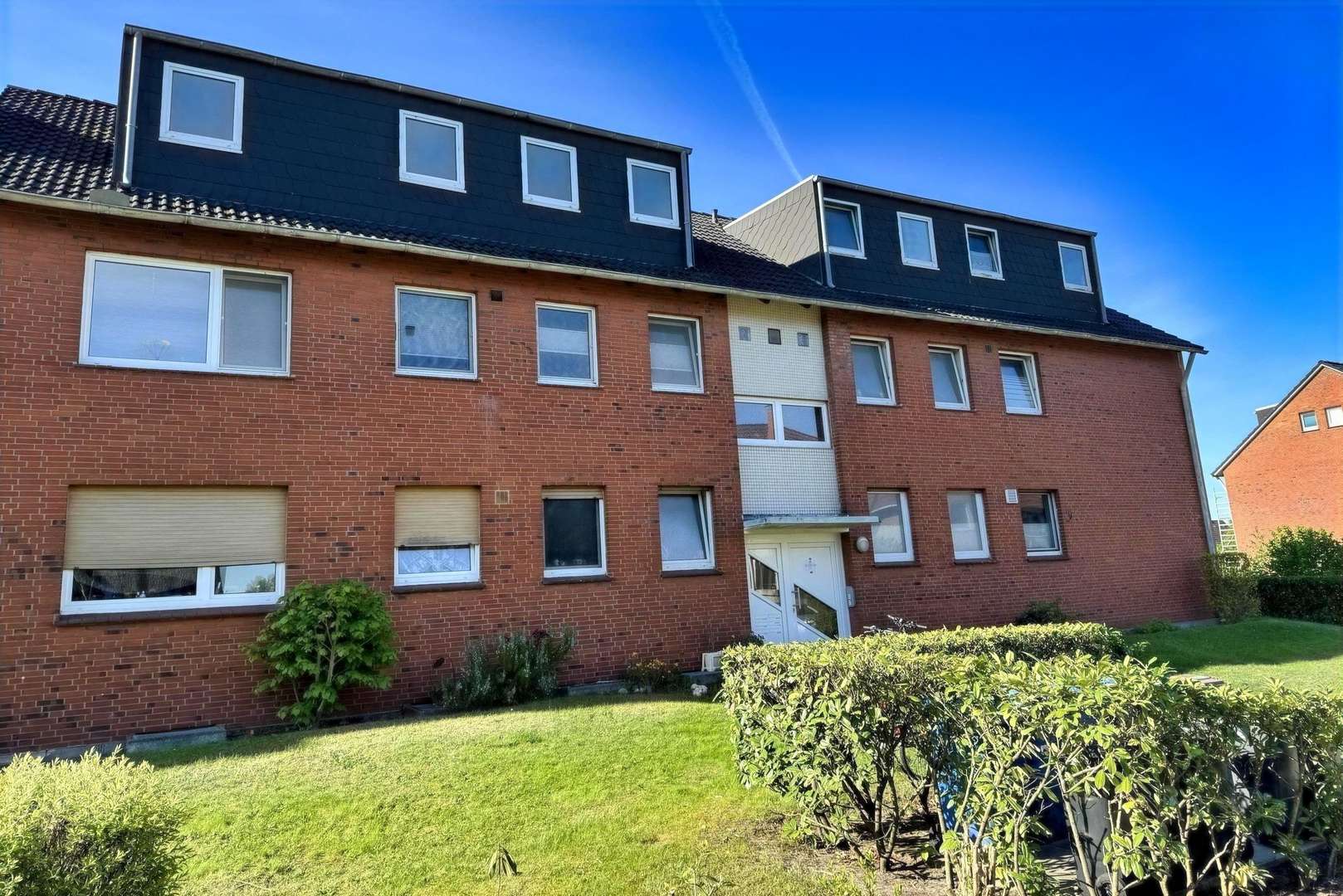 Straßenansicht - Dachgeschosswohnung in 27639 Wurster Nordseeküste mit 76m² kaufen