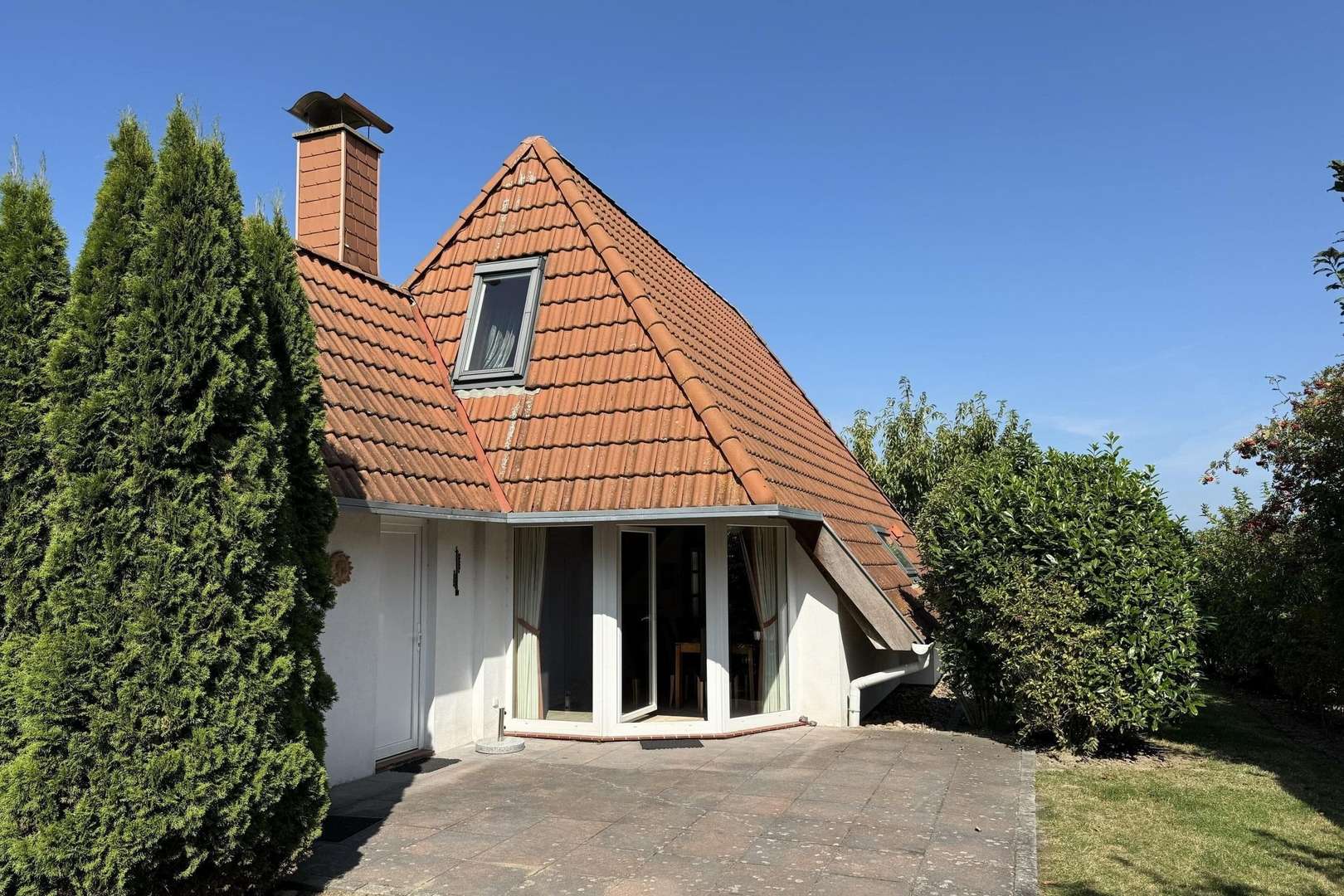 Gartenansicht mit Süd-Terrasse Gartenansicht mit Süd-Terrasse - Ferienhaus in 27639 Wurster Nordseeküste mit 85m² kaufen