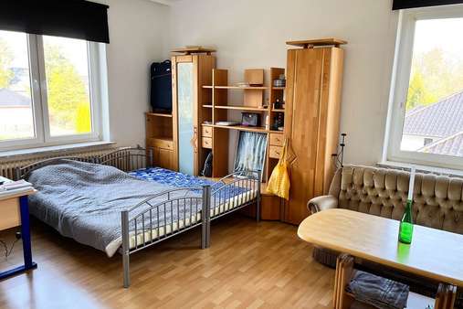 Wohnzimmer - Etagenwohnung in 27619 Schiffdorf mit 102m² günstig kaufen