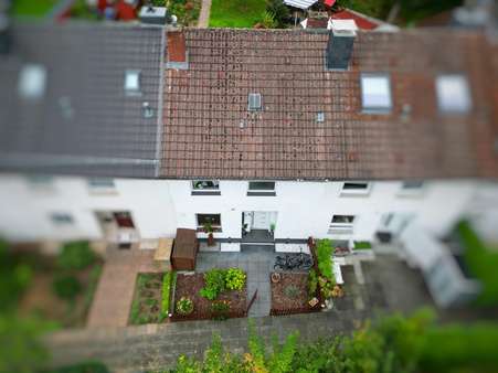 Luftaufnahme Front - Reihenmittelhaus in 51371 Leverkusen mit 94m² kaufen