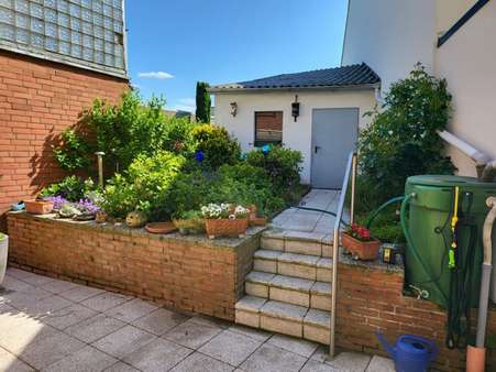 Gartenansicht im Sommer - Einfamilienhaus in 52457 Aldenhoven-Siersdorf mit 106m² kaufen