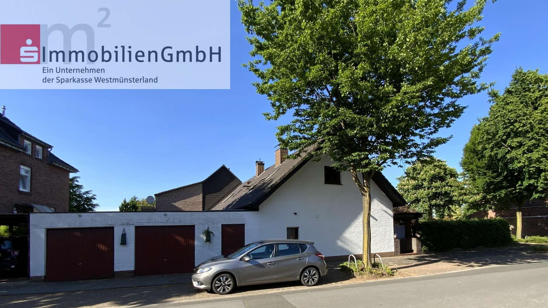 Seitenansicht mit Garagen und Gárten - Reihenendhaus in 46397 Bocholt mit 95m² kaufen
