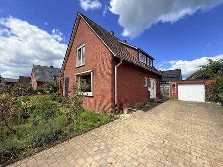 Vorder- und Seitenansicht Vorder- und Seitenansicht - Einfamilienhaus in 48429 Rheine mit 98m² kaufen
